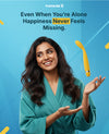 Woman in teal outfit with yellow object on blue background, text 'Pleasure X' and 'Even When You're Alone Happiness Never Feels Missing'. 